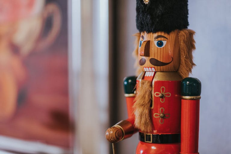 A detailed close-up of a colorful nutcracker figurine, perfect for festive decor.
