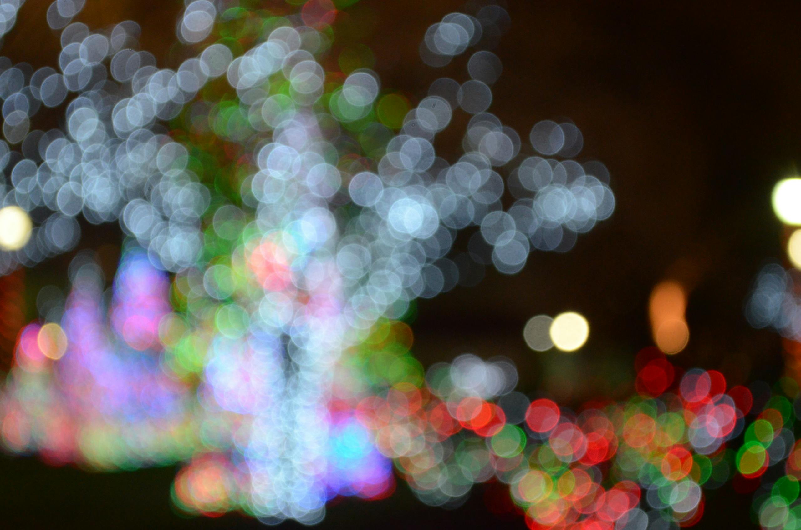 A mesmerizing display of colorful bokeh from Christmas lights creates a festive and dreamy atmosphere.