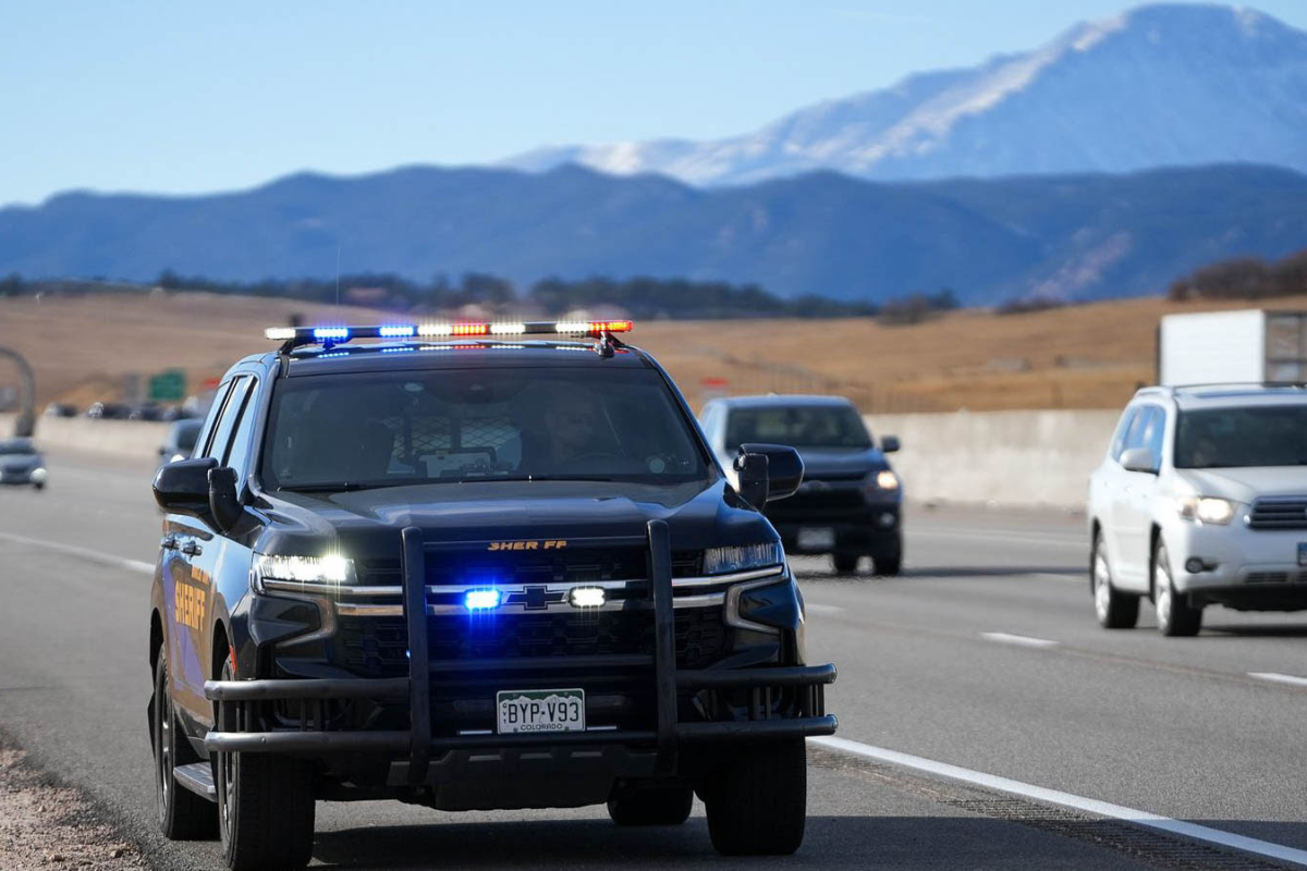 emergency vehicles driving down interstate