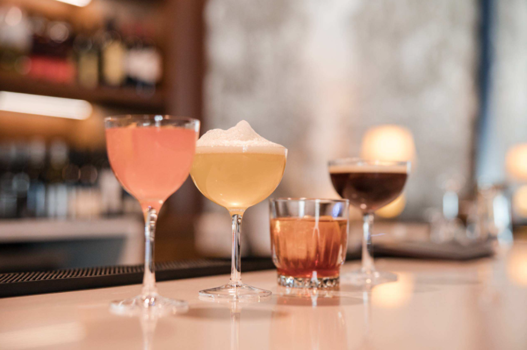 cocktails lined up on bar