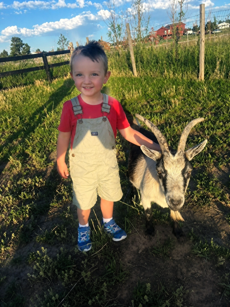 a boy standing with a goat